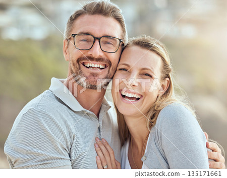 Happy, love and portrait of couple at beach for smile, travel and summer vacation. Happiness, holiday and romance with man and woman hugging on seaside date for bonding, affectionate and care Happy, love and portrait of couple at beach for smile, travel and summer vacation. Happiness, holiday and romance with man and woman hugging on seaside date for bonding, affectionate and care 135171661