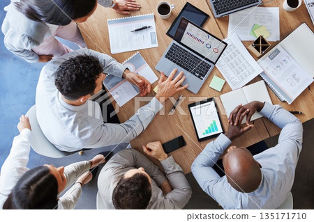 Laptop, planning and teamwork with business people in meeting from above for data, chart and strategy. Project management, budget and report with employees in office for finance, graph and research Laptop, planning and teamwork with business people in meeting from above for data, chart and strategy. Project management, budget and report with employees in office for finance, graph and research 135171710