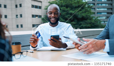 Black man, business lunch and credit card for meal and table payment of banking app. Cafe bill, rooftop coffee shop and African male person with phone and connectivity for transaction and pay 135171740