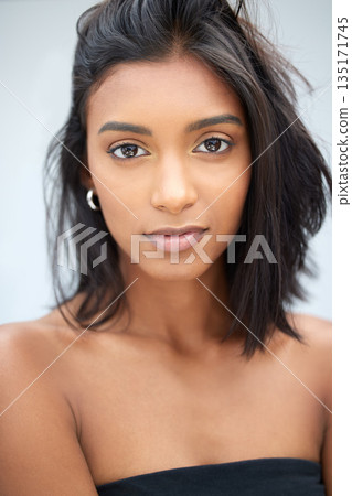 Beauty, fashion and makeup with portrait of woman for natural, cosmetics and confidence. Pride, trendy and face of Indian model on studio background for glamour, creative and classic style Beauty, fashion and makeup with portrait of woman for natural, cosmetics and confidence. Pride, trendy and face of Indian model on studio background for glamour, creative and classic style 135171745