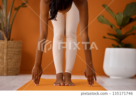 Stretching, fitness and a woman on the floor for exercise, training preparation and start. Healthy, wellness and a young person with a warm up getting ready for cardio, yoga or a home workout Stretching, fitness and a woman on the floor for exercise, training preparation and start. Healthy, wellness and a young person with a warm up getting ready for cardio, yoga or a home workout 135171746