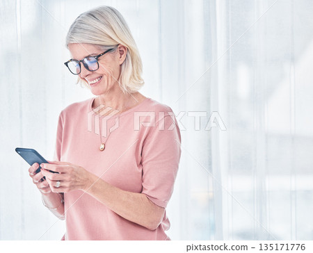Home, smile and senior woman with a smartphone, typing and connection for social media, website information and communication. Happy, mature female person and old lady with a cellphone and mobile app Home, smile and senior woman with a smartphone, typing and connection for social media, website information and communication. Happy, mature female person and old lady with a cellphone and mobile app 135171776