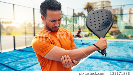Elbow pain, padel racket and man on court with sports injury, outdoor game and sprain for inflammation. Tennis, muscle tension or athlete with joint ache from training accident, tendinitis and strain Elbow pain, padel racket and man on court with sports injury, outdoor game and sprain for inflammation. Tennis, muscle tension or athlete with joint ache from training accident, tendinitis and strain 135171888