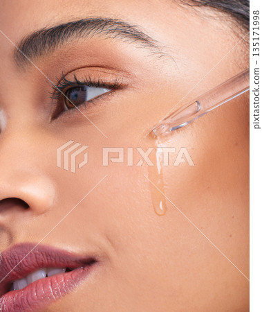 Beauty serum, woman and skincare closeup with dermatology and face cleaning. Wellness, hyaluronic acid and young female model with skin glow product and treatment with care and dropper in studio Beauty serum, woman and skincare closeup with dermatology and face cleaning. Wellness, hyaluronic acid and young female model with skin glow product and treatment with care and dropper in studio 135171998