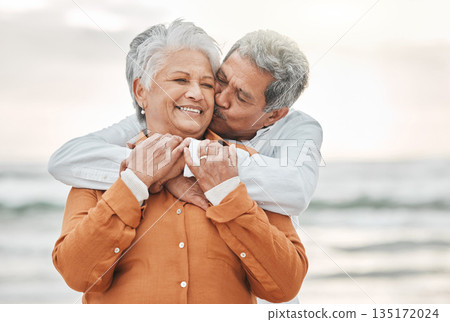 Happy senior couple, hug and beach with smile, bonding and kiss on cheek for romance, love and vacation. Elderly man, woman and embrace with happiness, retirement and travel by ocean for holiday Happy senior couple, hug and beach with smile, bonding and kiss on cheek for romance, love and vacation. Elderly man, woman and embrace with happiness, retirement and travel by ocean for holiday 135172024