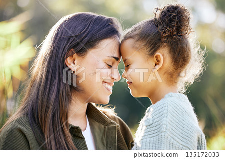 Happy, care and mother and child in nature for love, gratitude and kindness on mothers day. Smile, calm and a young mom with a girl kid and happiness, bonding and together in a park for quality time 135172033