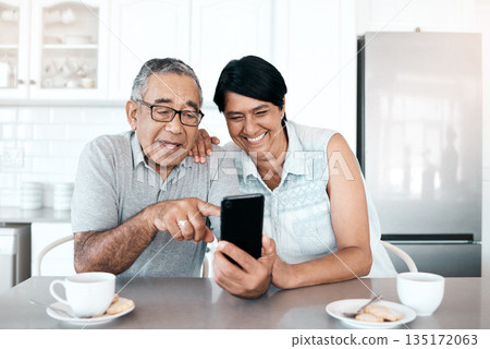 Happy, home and senior couple with a smartphone, connection and network with social media, mobile app or communication. Spouse, mature man or elderly woman with a cellphone, happiness or website info 135172063