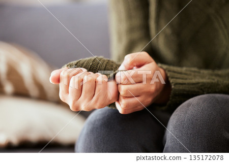 Hands, anxiety and closeup of a woman with depression, mental health problem and stress in home lounge. Female person on a couch for psychology, fear and abuse on a sofa while sad or depressed Hands, anxiety and closeup of a woman with depression, mental health problem and stress in home lounge. Female person on a couch for psychology, fear and abuse on a sofa while sad or depressed 135172078