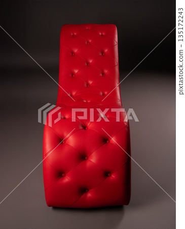 Elegant red tufted leather chair isolated on a dark gray studio background. Elegant red tufted leather chair isolated on a dark gray studio background. 135172243