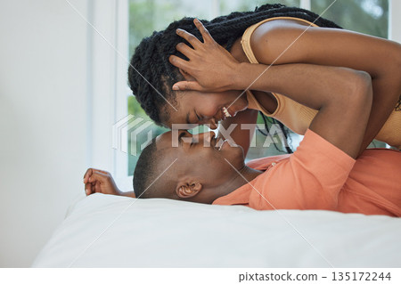 Happy couple, affection and in the bedroom with love, care and intimacy together. Smile, marriage and an African man and woman with happiness, embrace and passion on a bed of a house in the morning Happy couple, affection and in the bedroom with love, care and intimacy together. Smile, marriage and an African man and woman with happiness, embrace and passion on a bed of a house in the morning 135172244