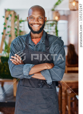 Portrait, cafe and black man with arms crossed, barista and service with happiness, proud and startup success. Face, happy male person and business owner with confidence, coffee shop and restaurant Portrait, cafe and black man with arms crossed, barista and service with happiness, proud and startup success. Face, happy male person and business owner with confidence, coffee shop and restaurant 135172247