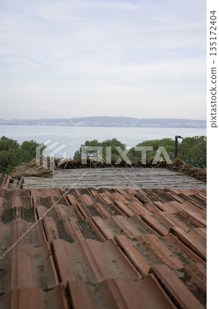Rustic brown tile roof and sea view 135172404