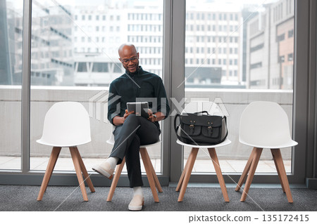 Business man, tablet and chair in waiting room, queue and opportunity of job interview, recruitment process or human resources. Black male, digital technology and browsing internet in line for hiring 135172415