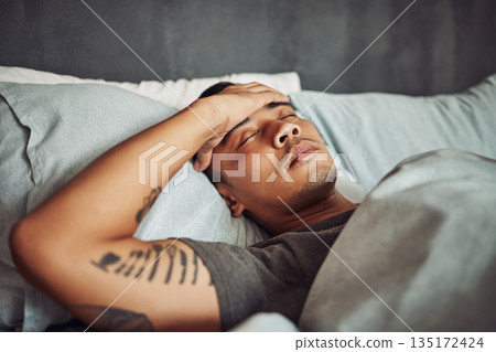 Tired, rest and sick man sleeping in the bedroom while in recovery or healing in his apartment. Burnout, illness and male person with a headache or fever taking a nap in bed at his modern home. Tired, rest and sick man sleeping in the bedroom while in recovery or healing in his apartment. Burnout, illness and male person with a headache or fever taking a nap in bed at his modern home. 135172424