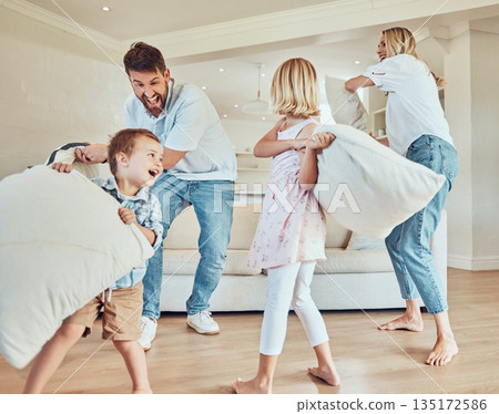 Pillow fight, playing and happy family of children in home laughing for funny games, joke and bond together in lounge. Excited mom, dad and playful kids with pillows for crazy energy in the morning Pillow fight, playing and happy family of children in home laughing for funny games, joke and bond together in lounge. Excited mom, dad and playful kids with pillows for crazy energy in the morning 135172586