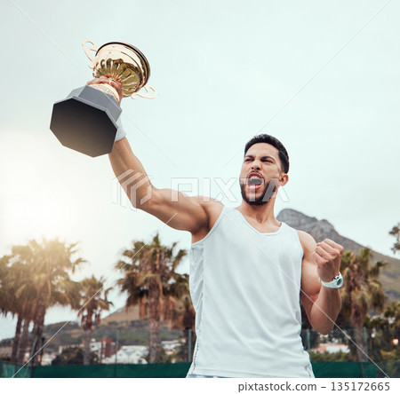 Happy man, trophy and tennis celebration for winning, success or victory achievement on the court. Male person, winner or champion with fist holding award, prize or reward in win, competition or goal 135172665