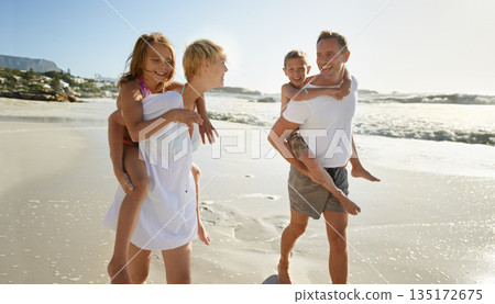 Beach, family walk and piggyback with laughing mother, father and kids together outdoor in nature travel. Sea, smile or happiness with bonding, parent support and love walking by the ocean on holiday Beach, family walk and piggyback with laughing mother, father and kids together outdoor in nature travel. Sea, smile or happiness with bonding, parent support and love walking by the ocean on holiday 135172675