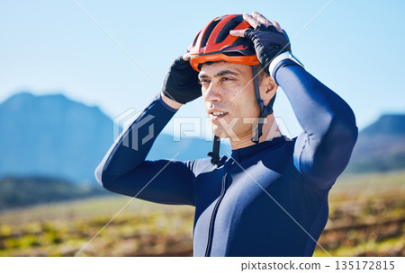 Mountain, helmet and man cycling in a marathon, fitness training or competition or sports adventure with blue sky. Gear, athlete and safety in outdoor cycle, bike ride or exercise in nature or park Mountain, helmet and man cycling in a marathon, fitness training or competition or sports adventure with blue sky. Gear, athlete and safety in outdoor cycle, bike ride or exercise in nature or park 135172815