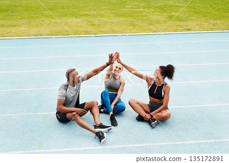Happy people, team and high five on stadium track for running, workout or exercise together in partnership. Sports group touching hands in support, fitness or friends in motivation, unity or training 135172891