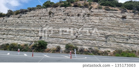 Mountain road curve with rocky cliff Mountain road curve with rocky cliff 135173003