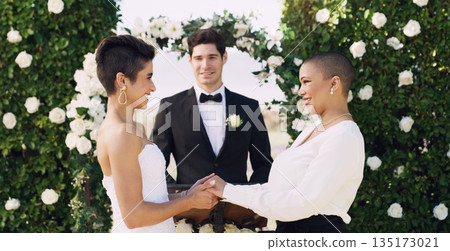 Love, holding hands and happy with lesbian couple at wedding for celebration, gay and pride. Smile, spring and happiness with women at marriage event for partner commitment, sexuality and freedom 135173021