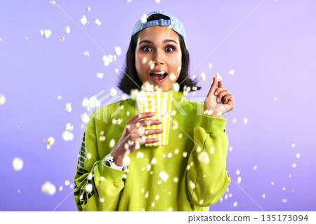 Popcorn, movie and woman surprise watching theatre or streaming service or cinema and in studio against a purple background. Video, entertainment and film or television or omg and snack on mock up Popcorn, movie and woman surprise watching theatre or streaming service or cinema and in studio against a purple background. Video, entertainment and film or television or omg and snack on mock up 135173094