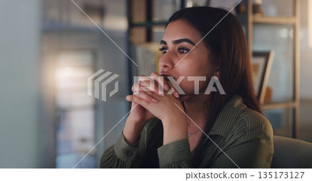Business woman, thinking and computer at night in office with anxiety, stress or crisis. Female entrepreneur at desk with tech while tired or worried about deadline, mistake or mental health problem 135173127