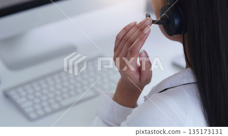 Closeup, business and woman with headphones, telemarketing and call center with advice, connection and advice. Female person, employee and agent with a headset, tech support and customer service 135173131
