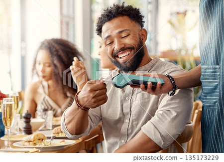 Ecommerce, credit card and man in a restaurant, machine and online payment with happiness, retail and social gathering. Male person, group and customer in a cafe, service and transaction for lunch 135173229