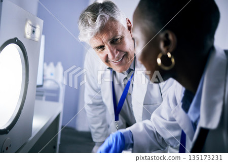 Science, autoclave and laboratory with man, medicine and black woman with check for medical research. Scientist teamwork, diversity and smile together for pharmaceutical innovation in lab with mentor Science, autoclave and laboratory with man, medicine and black woman with check for medical research. Scientist teamwork, diversity and smile together for pharmaceutical innovation in lab with mentor 135173231