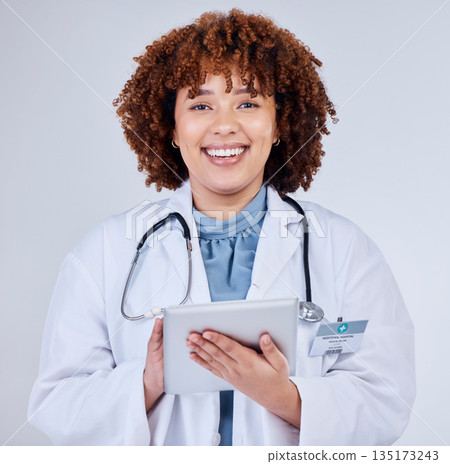 Tablet, doctor portrait and woman isolated on a white background of happy healthcare research or telehealth services. Face of african medical person typing on digital tech and paperless app in studio Tablet, doctor portrait and woman isolated on a white background of happy healthcare research or telehealth services. Face of african medical person typing on digital tech and paperless app in studio 135173243