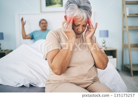 Senior couple, bed and conflict with a headache, fight and relationship issue with marriage, home and retirement. Partners, mature man and elderly woman with a migraine, bedroom and angry with stress 135173257