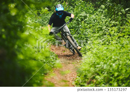 Mountain bike, man and cycling in forest for adventure, freedom and power of off road challenge on path. Athlete, sports and bicycle for action, competition and cardio racing for adrenaline in nature 135173297