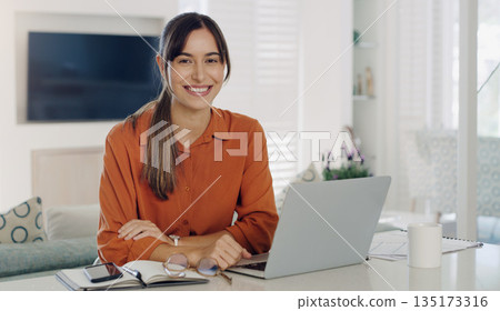 Happy woman, remote work and portrait at laptop in home for digital planning, online research and elearning at table. Female freelancer working on computer, technology and web connection for blogging Happy woman, remote work and portrait at laptop in home for digital planning, online research and elearning at table. Female freelancer working on computer, technology and web connection for blogging 135173316
