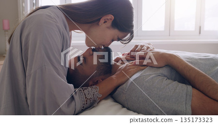 Couple, love and kiss in bed, room and romance of intimacy, special moment and bonding together at home. Young man, woman and kissing partner for happy relationship, honeymoon and care in the morning Couple, love and kiss in bed, room and romance of intimacy, special moment and bonding together at home. Young man, woman and kissing partner for happy relationship, honeymoon and care in the morning 135173323