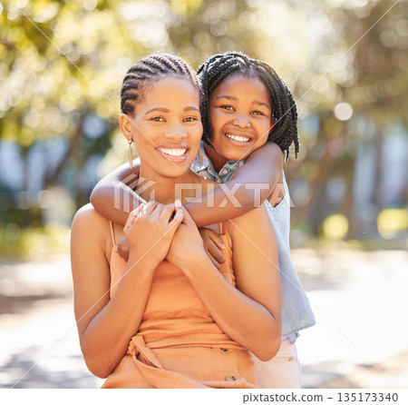 Hug, mother and daughter portrait in park relaxing together on summer holiday with smile. Support, girl child or happy black woman, mom and bonding in embrace with love in garden in South Africa Hug, mother and daughter portrait in park relaxing together on summer holiday with smile. Support, girl child or happy black woman, mom and bonding in embrace with love in garden in South Africa 135173340