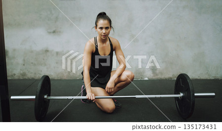Weight lifting, body builder and portrait of woman with barbell in gym for training, exercise and workout. Fitness, muscle and strong female person with weights for challenge, wellness and strength Weight lifting, body builder and portrait of woman with barbell in gym for training, exercise and workout. Fitness, muscle and strong female person with weights for challenge, wellness and strength 135173431