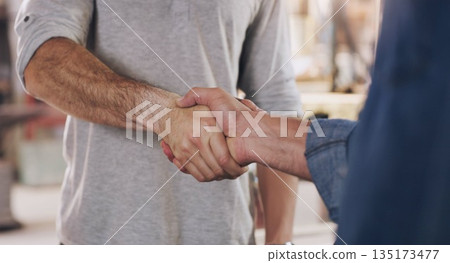 Handshake, welcome and partnership with men in a workshop together for a deal or agreement. Teamwork, meeting and greeting with male industry people shaking hands in a factory to gesture thank you Handshake, welcome and partnership with men in a workshop together for a deal or agreement. Teamwork, meeting and greeting with male industry people shaking hands in a factory to gesture thank you 135173477