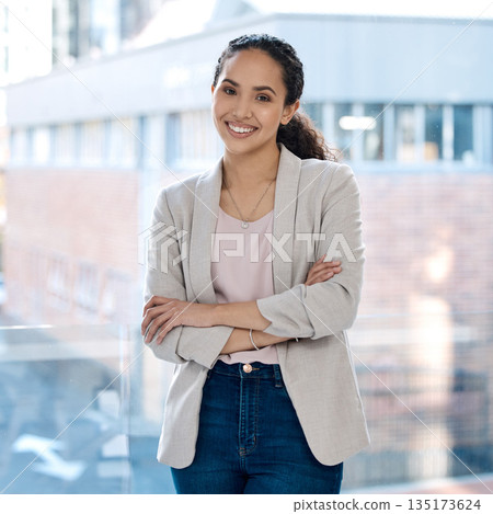 Happy, arms crossed and portrait of business woman in office for professional, corporate and confident. Smile, happiness and pride with female employee at window for mission as expert or entrepreneur 135173624