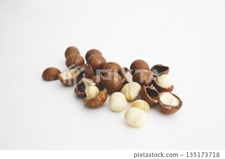 Shelled macadamia nuts on a white background 135173718