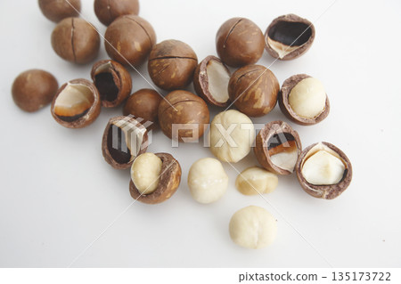 Shelled macadamia nuts on a white background 135173722