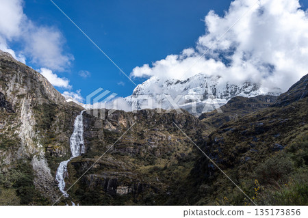 Waterfall cascading from snowy mountains on the Laguna 69 trek, Peru 135173856
