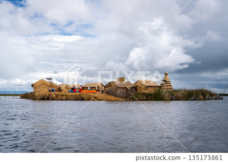 Floating island "Uros Titino" on Lake Titicaca in Peru Floating island "Uros Titino" on Lake Titicaca in Peru 135173861