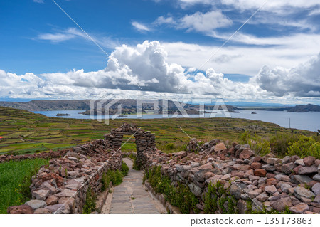 Stone pathway and arch at Pachatata archaeological site, Amantani Island, La ke Titicaca, Peru Stone pathway and arch at Pachatata archaeological site, Amantani Island, La ke Titicaca, Peru 135173863