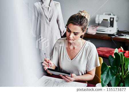 Fashion, woman and design on tablet ideas, internet app for small business idea with creative process in studio. Creativity, textile and designer drawing digital sketch with pattern and illustration. Fashion, woman and design on tablet ideas, internet app for small business idea with creative process in studio. Creativity, textile and designer drawing digital sketch with pattern and illustration. 135173877