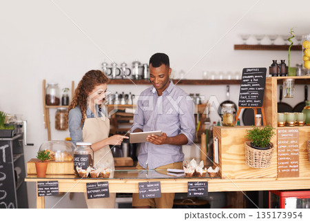 Restaurant owners, tablet and teamwork of people, manage orders and discussion in store. Waiters, black man and happy woman in cafe with technology for inventory, stock check and managing sales. 135173954