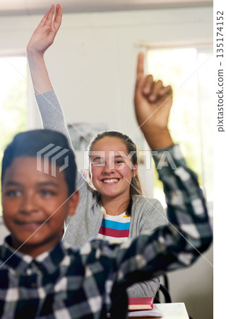 Question, happy and hands of children in classroom for answer in lesson, learning and education. Child development, school and young girl student with hand raised for asking, feedback and knowledge Question, happy and hands of children in classroom for answer in lesson, learning and education. Child development, school and young girl student with hand raised for asking, feedback and knowledge 135174152