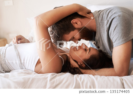Couple, bed and embrace with face, smile and together in morning for romance, love and bonding in home. Young man, woman and happiness in bedroom with care, support and conversation at apartment Couple, bed and embrace with face, smile and together in morning for romance, love and bonding in home. Young man, woman and happiness in bedroom with care, support and conversation at apartment 135174405