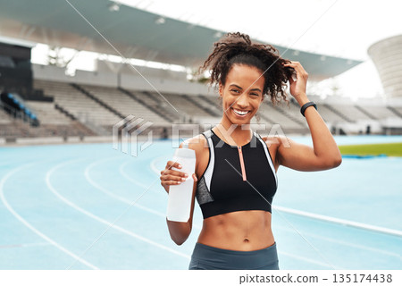 Fitness, running and portrait of happy woman with water at stadium, relax at marathon training or exercise. Workout, health and body, female sports runner at arena track with smile and bottle. 135174438