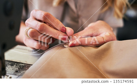 Sewing machine, woman hands and clothing designer with button and thread work. Small business, entrepreneur and female tailor with boutique and creative worker working with machinery for fashion Sewing machine, woman hands and clothing designer with button and thread work. Small business, entrepreneur and female tailor with boutique and creative worker working with machinery for fashion 135174591